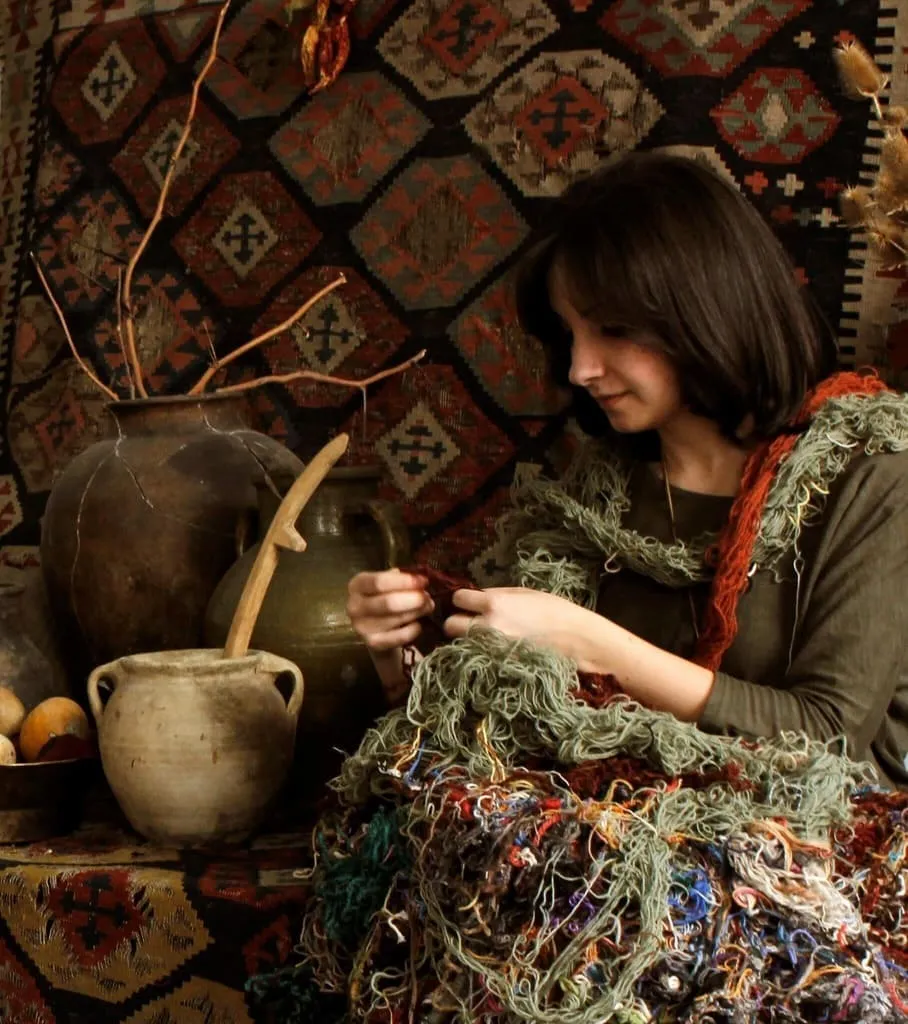 Artist weaving traditional tapestry textile art — the fine art roots behind Fairy Tale Publishing